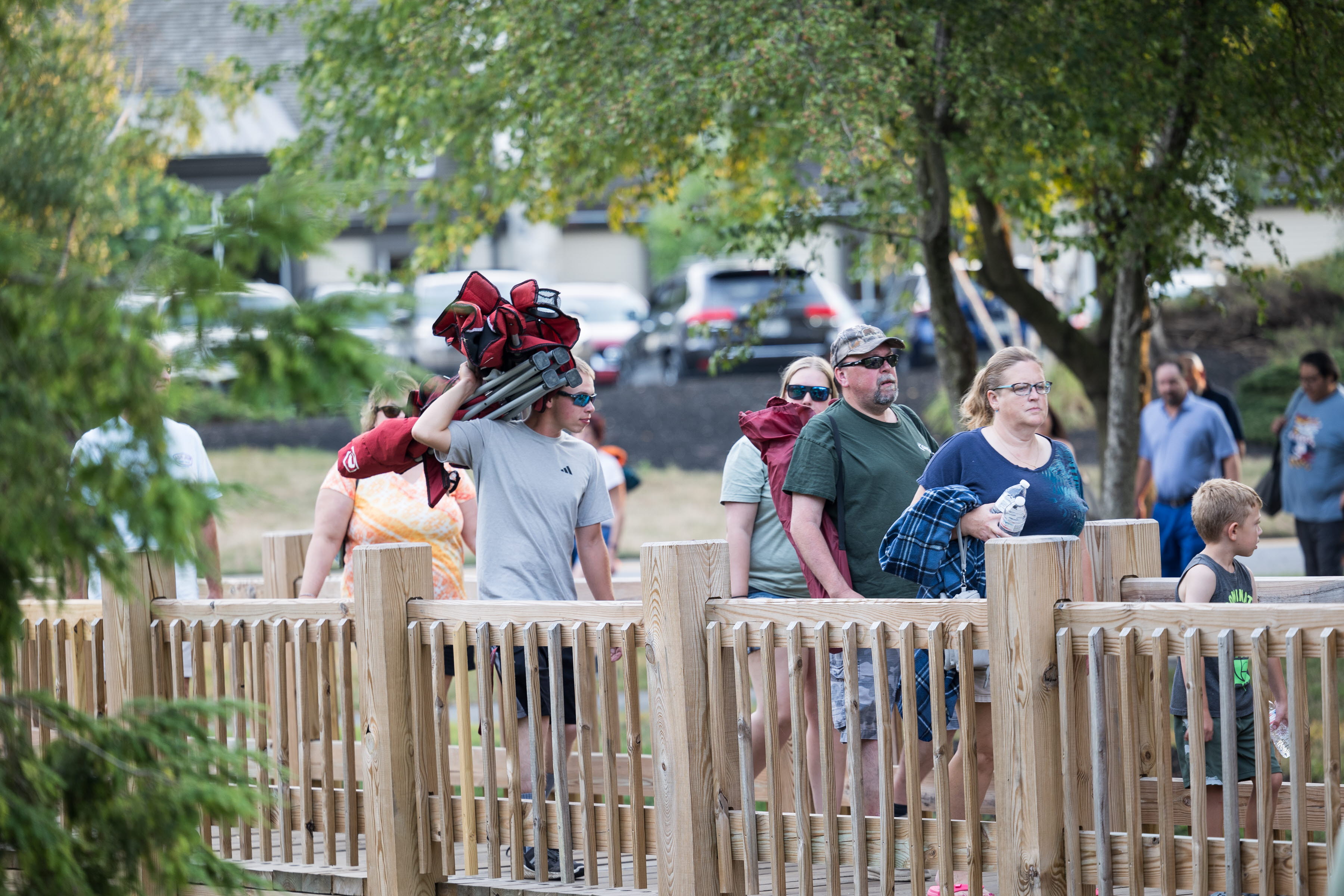 People arriving at outdoor concert 